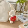 The white bear doll has a red heart-shaped ornament on its chest embroidered with the yellow words "2023" details Picture
